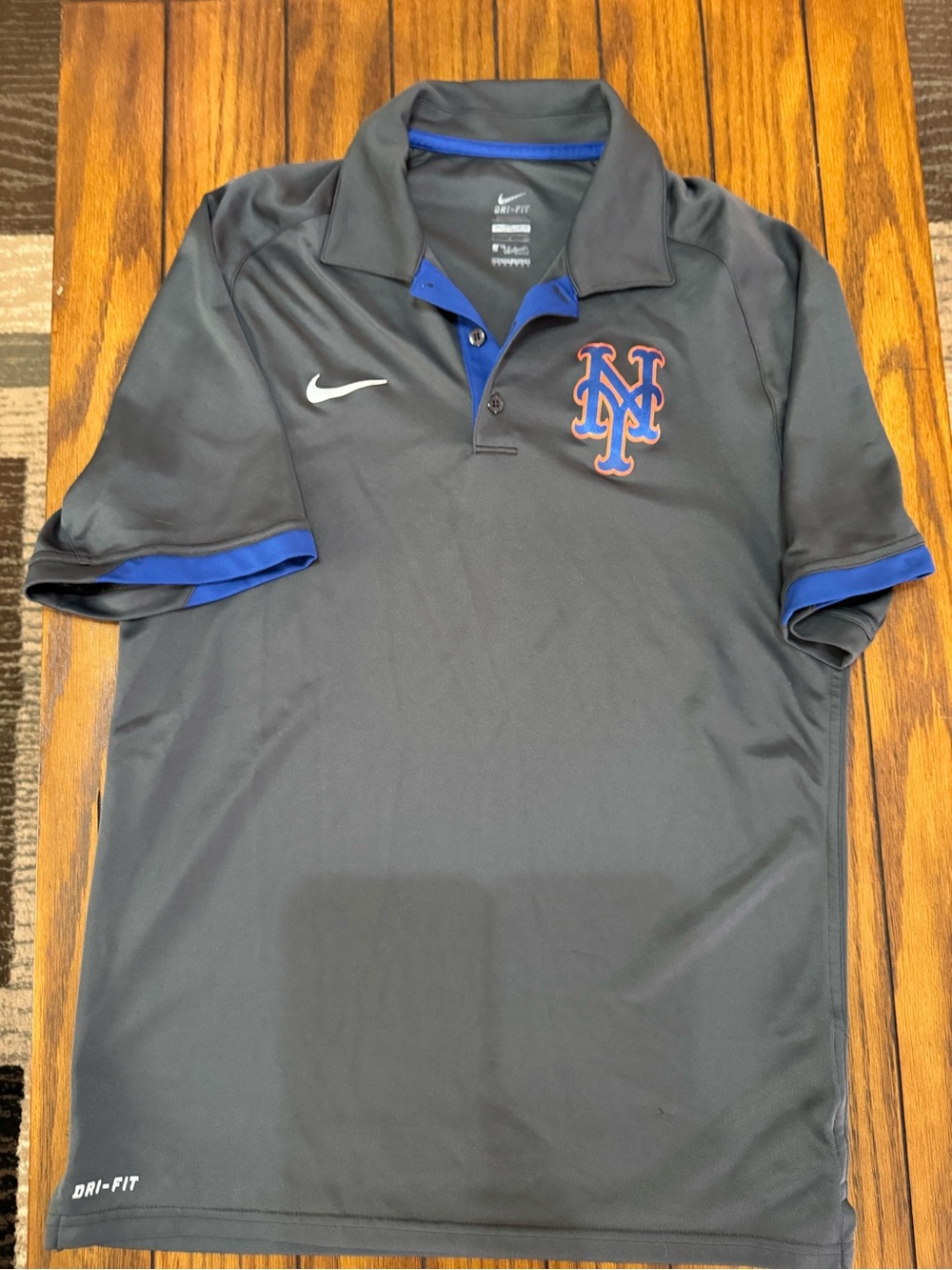 Nike Men’s Black Dri-FIT Polo with Blue Trim and Orange Logo